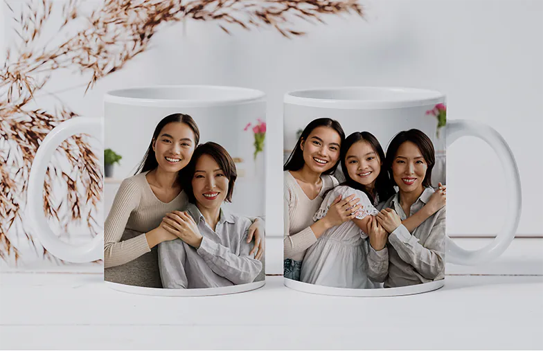["Personalised Photo Mugs from Printerpix","Mother and baby holding a custom mug with cartoon design and the text 'Papa' from Printerpix","Personalised photo mug with an image of a crawling baby in an animal onesie","Mother and daughter holding custom-designed photo mugs with family photos","Kissing couple with personalised mugs with text","Personalised photo mug with your own dog photo","","","",""]||||||||||