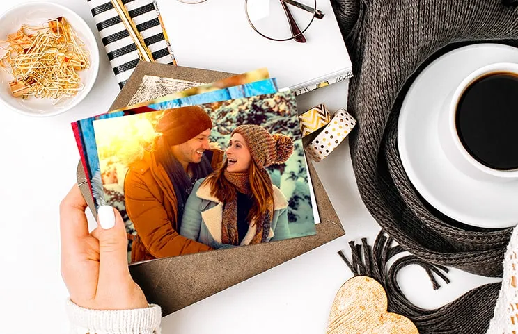 Stack of personalized photo prints from the Printerpix online photo printing service