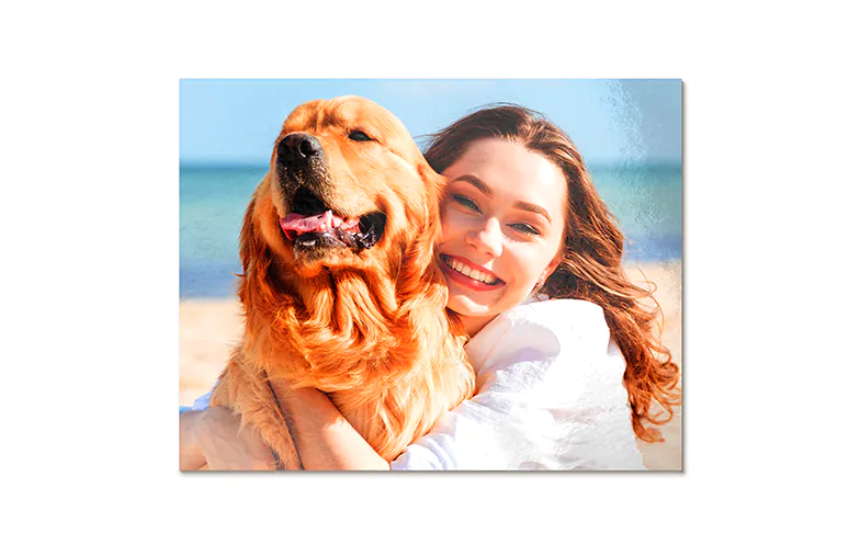 Aluminium photo print of a mountain and lake, held by a woman, made by Printerpix