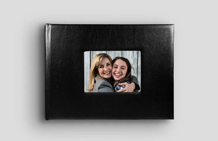 ["Lorenzo window cover photo book by Printerpix","Black leather photo book with window in the cover and picture of mother and daughter","","Beige leather photo book with window in the cover and baby photo","","","","","",""]||||||||||