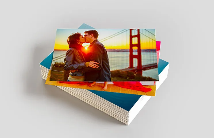 Stack of personalised photo prints from Printerpix's online photo service