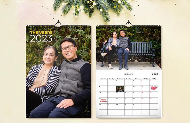 Personalised Wall Hanging 2020 Photo Calendar by Printerpix|Girlfriend's photo on personalised wall calendar hanging in the living room|Woman writing on A4 personalised wall calendar by Printerpix with Christmas theme|A3 2020 wall calendar with personalised photo design by Printerpix hanging|Romantic couple in the living room with personalised 2020 wall calendar featuring engagement photo|Dog photos on custom-designed photo calendar hanging on the wall|||||