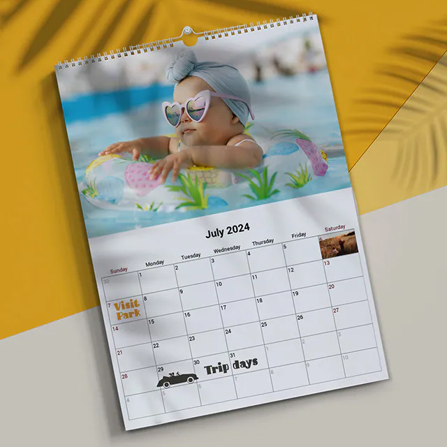 Personalisierter Wandbehang 2020 Fotokalender von Printerpix|A3 Personalisierter Wandkalender|Woman writing on A4 custom wall calendar from Printerpix with Christmas-themed photo|A3 2020 Wall Calendar with personalized photo design from Printerpix displayed|Romantic couple in living room with personalized 2020 wall calendar featuring engagement photo|Dog photos on custom-designed photo calendar hanging on the wall|||||