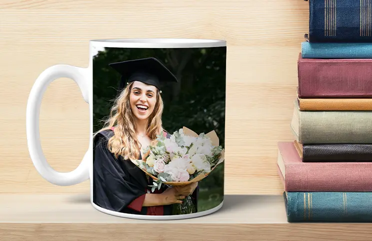 ["Personalised photo mugs by Printerpix","Mother and baby holding a mug with custom cartoon design by Printerpix and text 'Papa'","Personalised photo mug with image of a crawling baby in an animal onesie","Mother and daughter holding custom-designed photo mugs with family photos","Kissing couple with personalised mugs with text","Personalised photo mug with your own photo of a dog","","","","",""]||||||||||