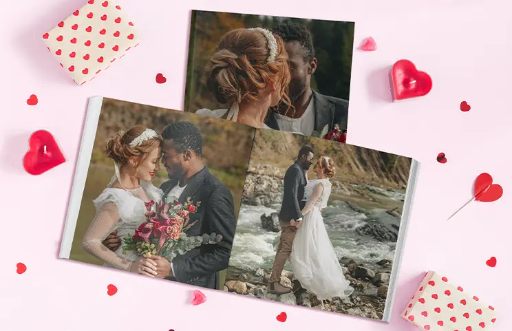 ["Hardcover Personalised Photo Books by Printerpix","Custom printed Printerpix photo album with hardcover and large photos of an older couple","Personalised photo album book with romantic pictures of a couple and a photo cover","Family photo album with custom-printed cover and family name","Pet and woman looking at personalised family photo album with custom design","Two people looking at Printerpix photo book with wedding photos and bride","","","",""]||||||||||