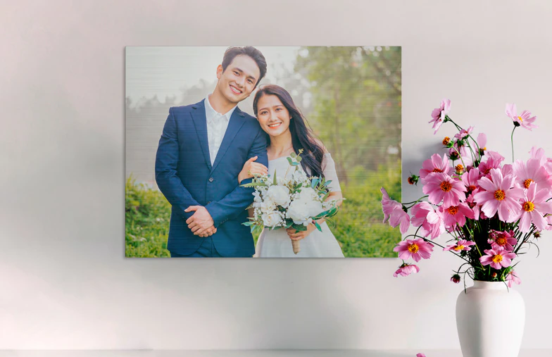 ["Metal Photo Print by Printerpix", "Aluminum Photo Print of a Mountain and Lake, Held by a Woman, Made by Printerpix", "Small Square Metal Print of a Man Diving into a Lake", "Metal Photo Print of Mother and Daughter on Bookshelf", "Woman Placing Metal Photo Print of Friend and Boyfriend on the Wall", "Three Metal Photo Prints in Different Sizes", "", "", "", "", ""]||||||||||