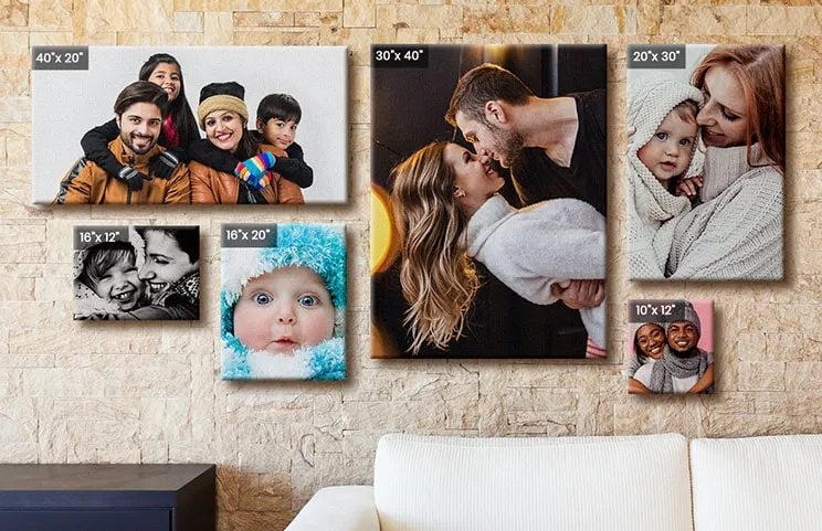 Wall with 6 differently sized canvases featuring various family photos