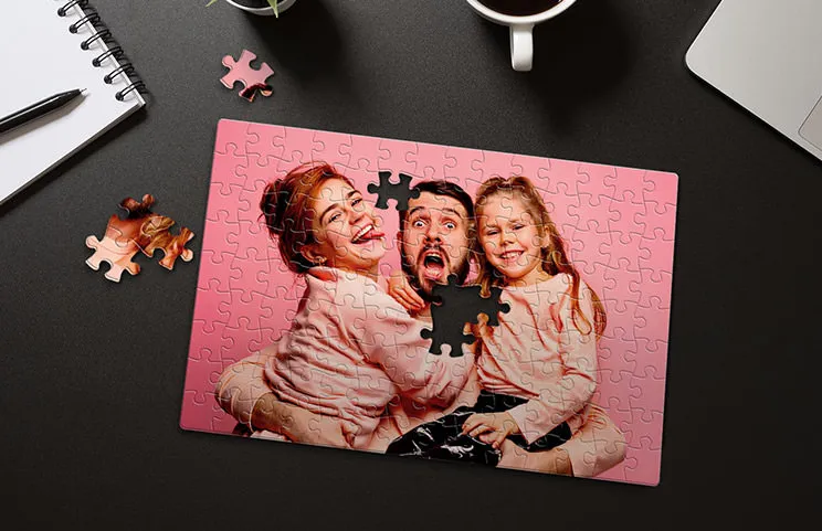 Pink cardboard puzzle with family photo