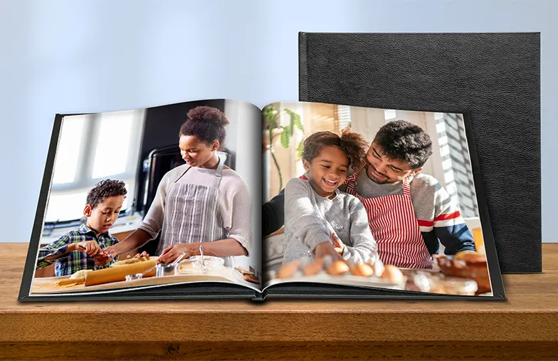 Custom-designed Photo Album on Table with a Photo Collage of Family Pictures