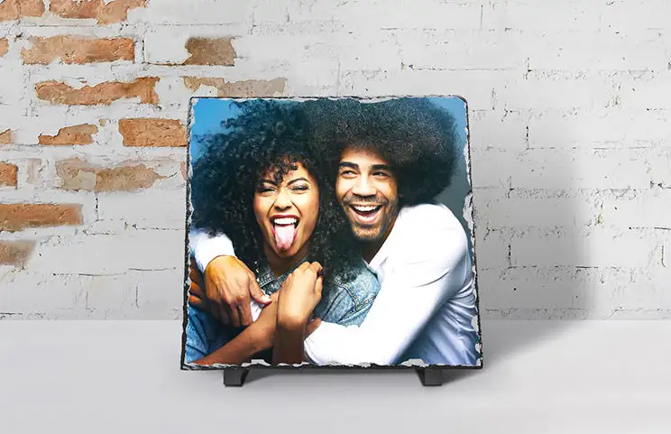 Two young people printed on a stone
