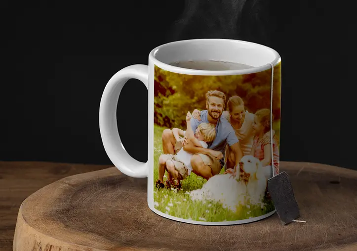 Mother and daughter holding custom-designed photo mugs with family photos