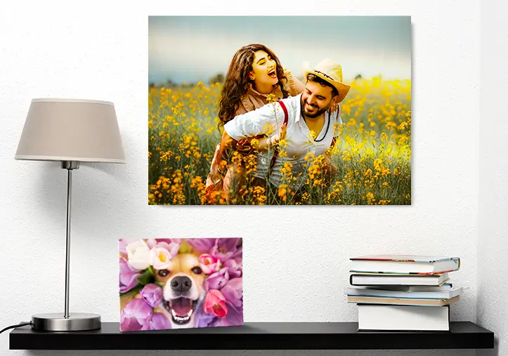 Woman placing metal picture of friend and boyfriend on the wall