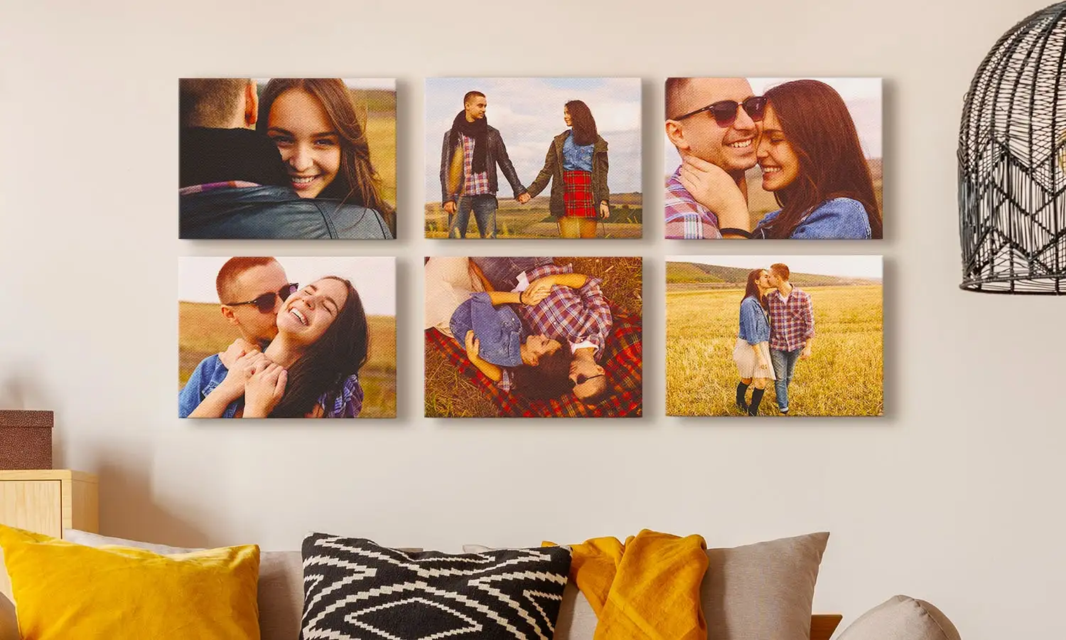 Young man holds a canvas of two people sitting by a lake against a wall, directed by a young woman
