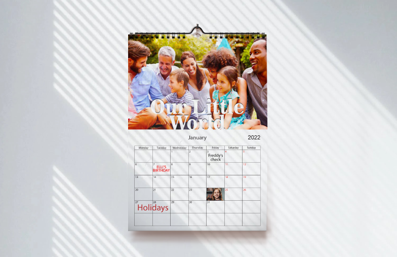 Dog photos on custom-designed photo calendar hanging on the wall